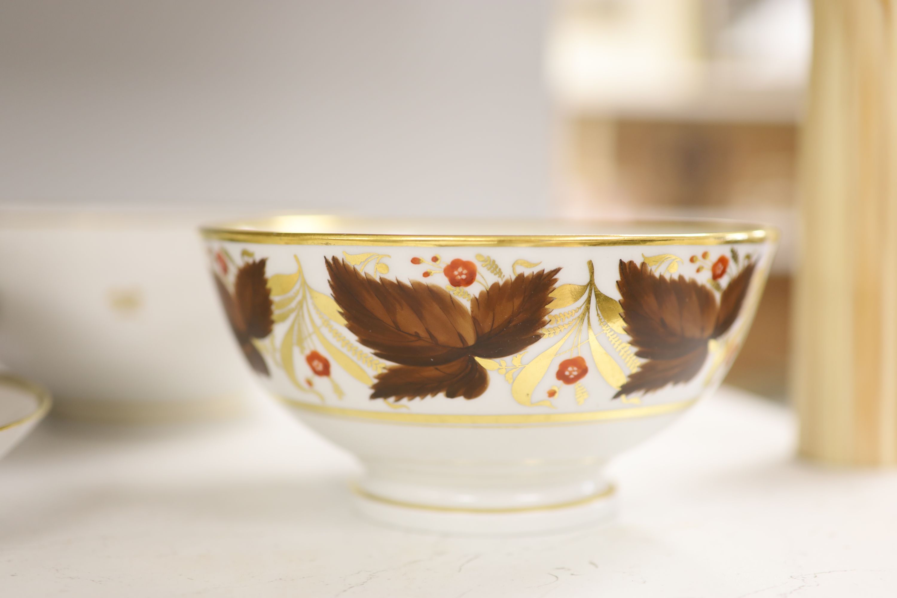 A Barr Flight and Barr bowl painted with brown leaves and red flowers, bowl and matching saucer, height overall 9cm, and a BFB bowl pri